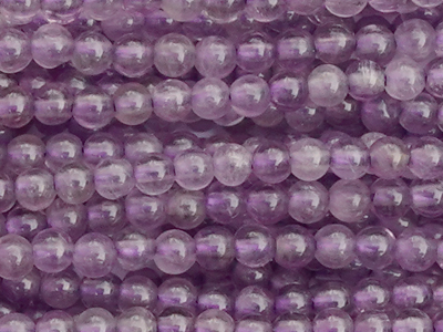 winzige runde Amethyst Steinperlen 2mm - Nahaufnahme